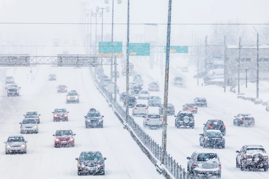 Cars driving on snowy highway