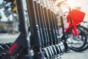 Electric scooters parked near a busy intersection in Downtown Houston