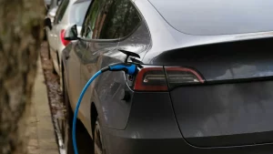 man charging tesla