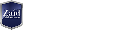Zaid Trial Attorneys logo: blue shield badge with white text on a light background (left).